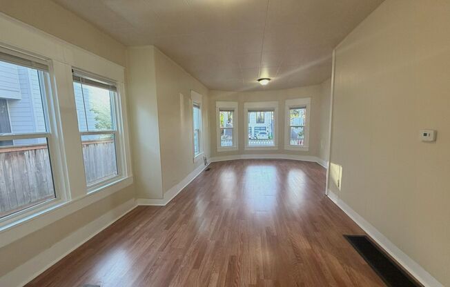 Charming 1907 house with stunning front porch and spacious back yard!