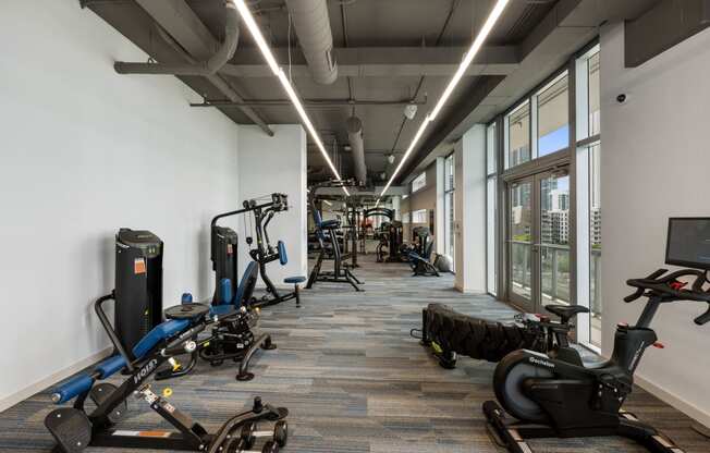 an image of a gym with weights and cardio equipment