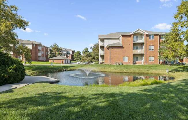 A large building with a fountain in front of it.