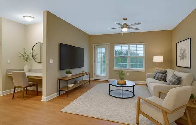 A living room with a television, a couch, and a coffee table.