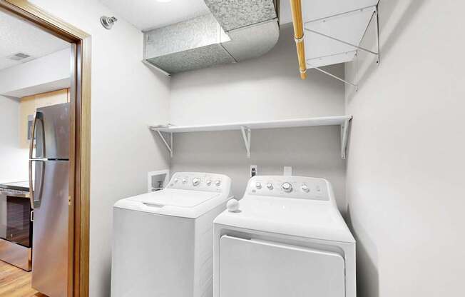 A laundry room with a washer and dryer.