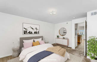 A bedroom with a bed, nightstand, and a painting on the wall at Colonial Pointe at Fairview Apartments, Bellevue, Nebraska