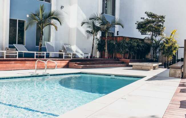 Courtyard Resort-style heated pool with lounge chairs