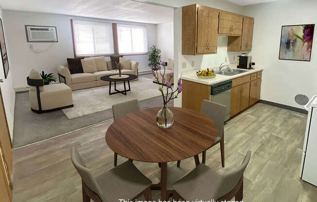 A kitchen with a table and chairs in the middle of the room.
