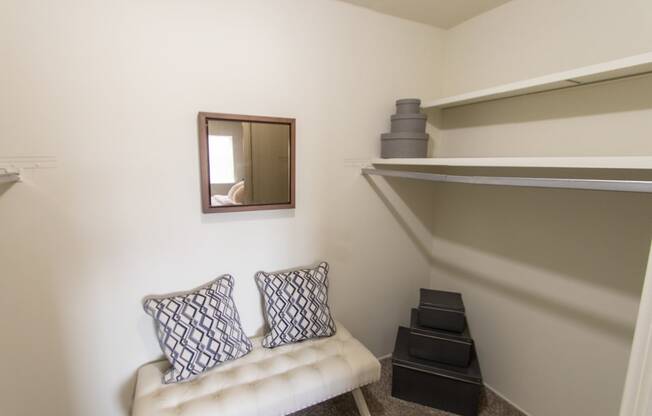 This is a photo of the primary bedroom walk-in closet in the 705 square foot 2 bedroom, 1 bath apartment at Lisa Ridge Apartments in the Westwood neighborhood of Cincinnati, Ohio.