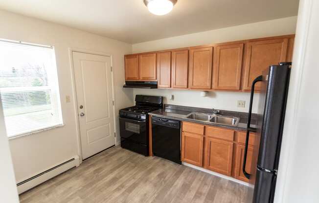 This is a photo of the kitchen in the 1004 square foot, 2 bedroom, 1.5 bath townhome floor plan at Lake of the Woods Apartments in Cincinnati, OH.