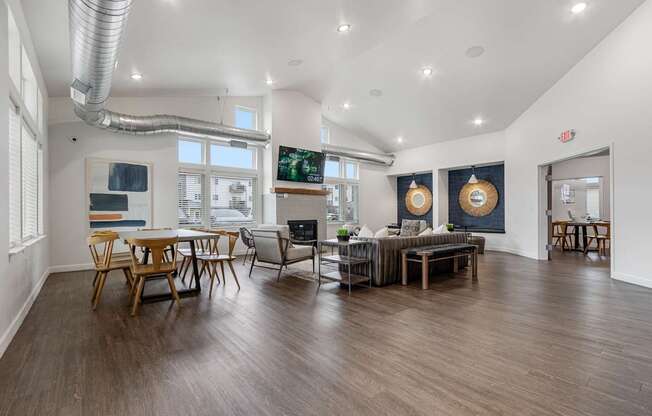 A modern living room with wooden floors and furniture.