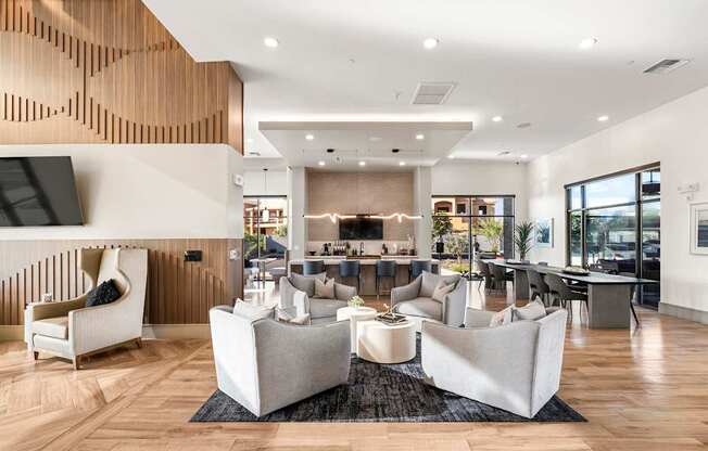 A modern living room with a wooden wall and white furniture.