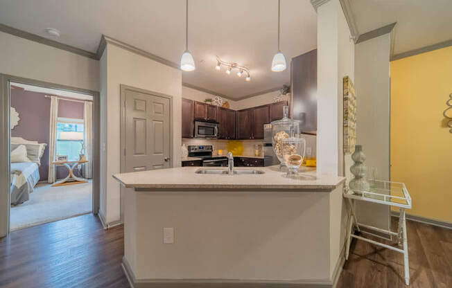 a kitchen with a counter top and a sink
