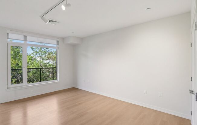 Unfurnished bedroom with sliding door window at Park77 Apartments, Massachusetts, 02138