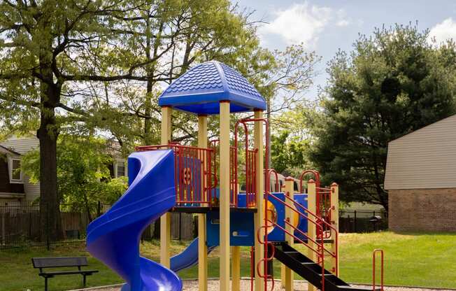 a playground with a blue slide