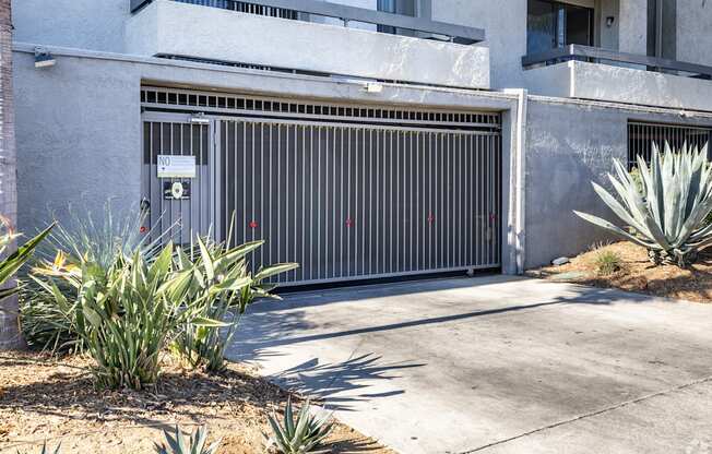 a garage door in front of an apartment building