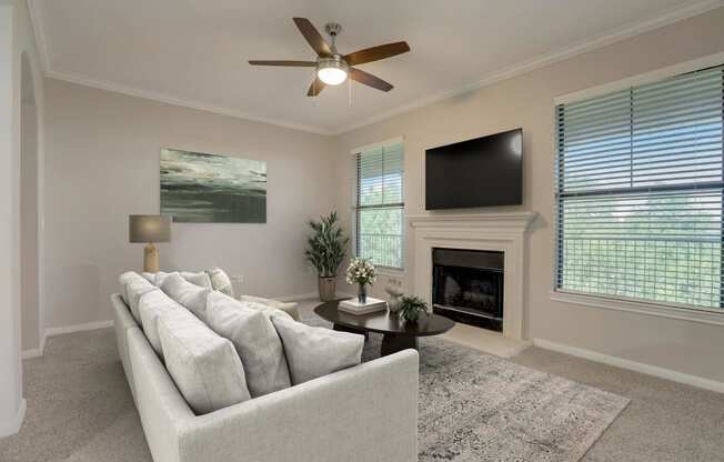 a living room with a couch and a tv at The Vista on Brodie, Austin, TX, 78745