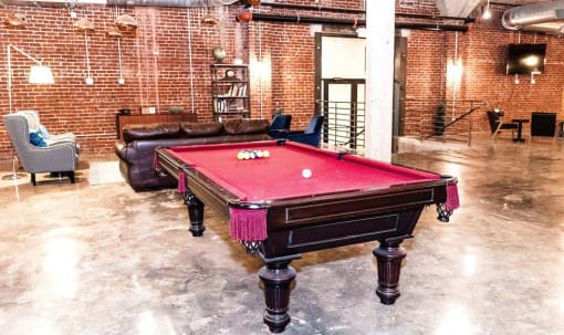 a red pool table in a living room