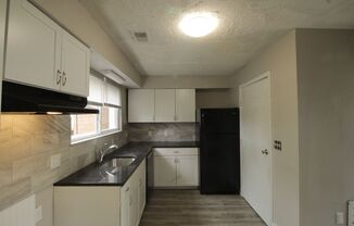 Renovated townhome with central air and off-street parking