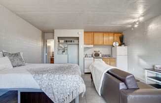 Bedroom & kitchen at University Manor Apartments in Tucson, AZ