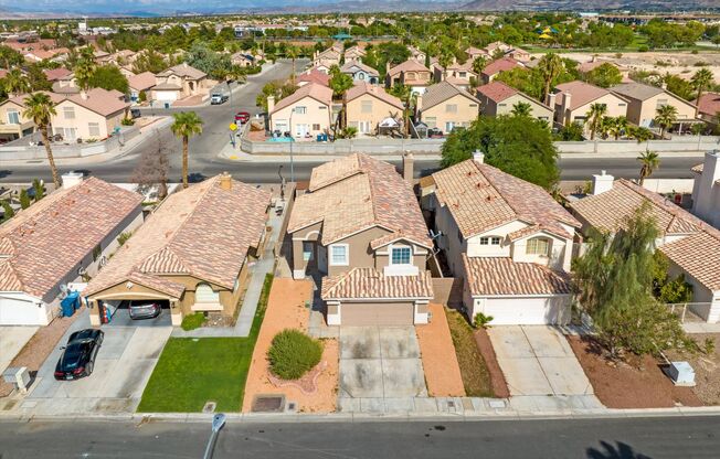 SE!! Windmill and 215!! Newly remodeled!! All Tile Floors down stairs!! Low Maintenance Desert Landscape Front & Back!!