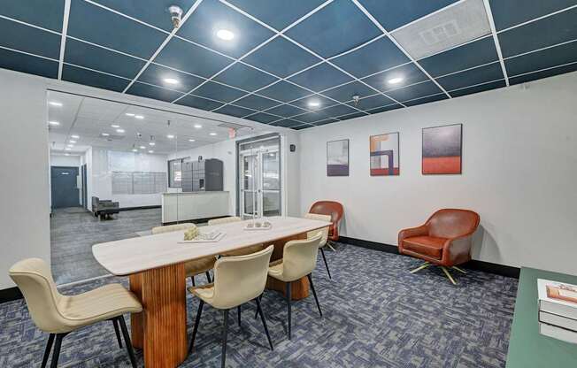 A conference room with a long table and chairs.