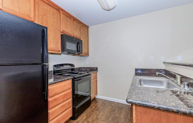 a kitchen with a stove top oven sitting inside of a refrigerator