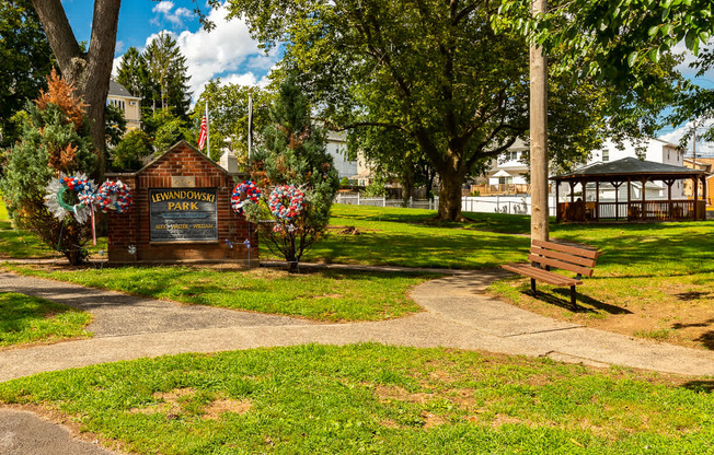 A park with a sign at Vermella Lyndhurst apartments, Lyndhurst 07071