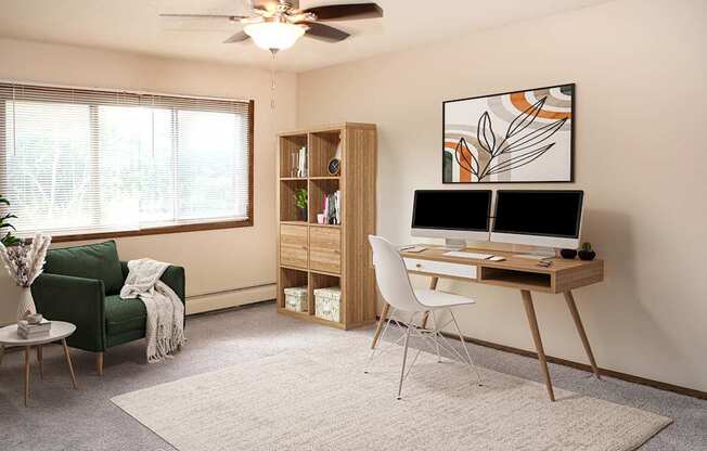 A room with a green chair, a desk, and a ceiling fan.