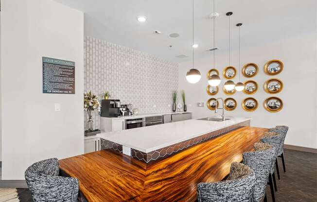 A modern dining room with a wooden table and chairs.