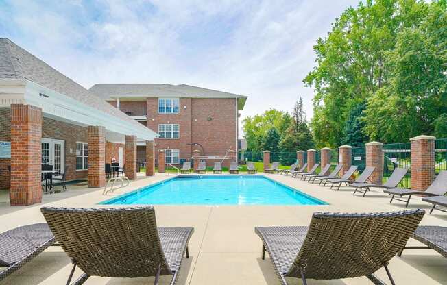 Swimming pool with lounge chairs for sunbathing