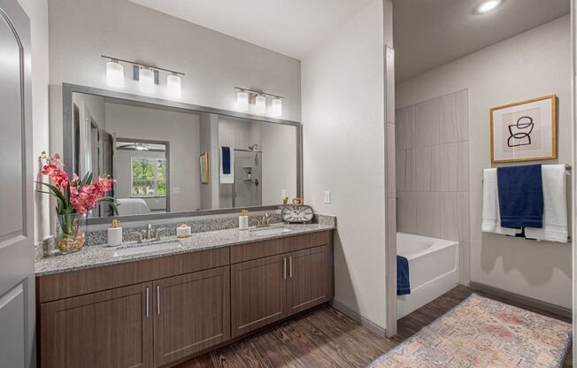 the retreat at thousand oaks spacious bathroom with granite counter tops and large mirror