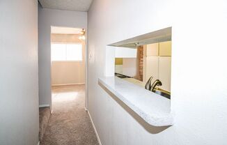 a bathroom with a sink and a mirror on the wall