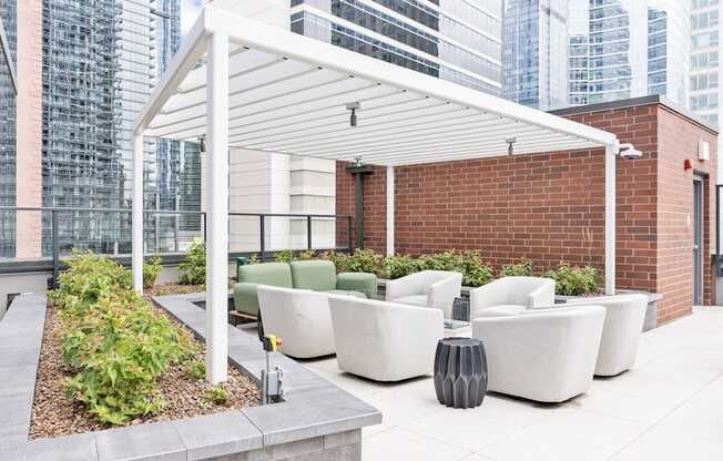 a terrace with couches and chairs and a white canopy  at Cassidy on Canal, Illinois, 60606