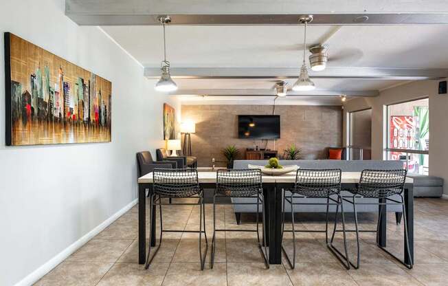 a dining room with a table and chairs