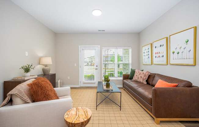 a living room with a leather couch and a coffee table