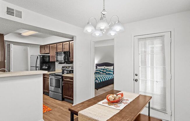 a kitchen and dining room with a table