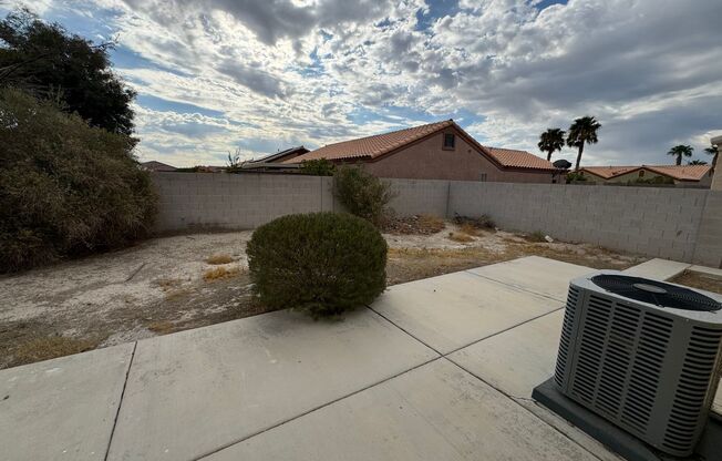 Colorful single story 4 bedroom home with tile flooring.