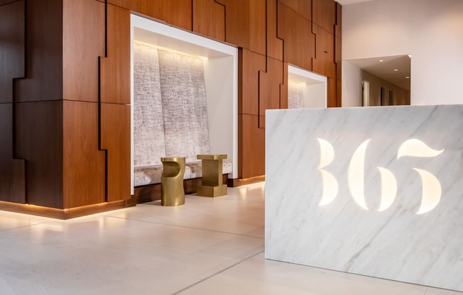 A modern interior with a large number 365 on a white marble surface.