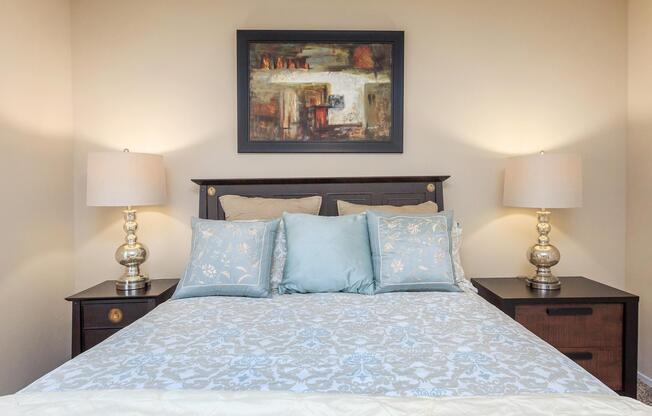 bedroom with a blue comforter