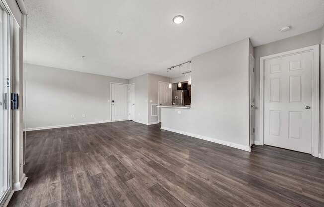 A room with wooden floors and white walls.