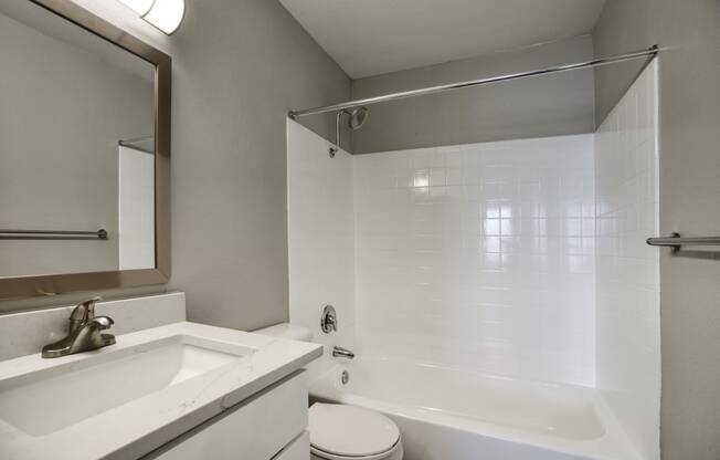 a bathroom with a sink toilet and bathtub