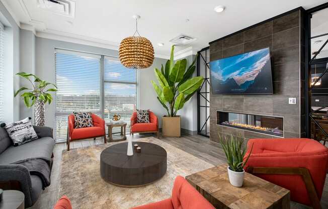 a living room with a fireplace and a tv