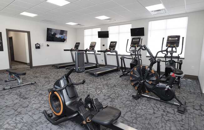 a room filled with lots of exercise equipment