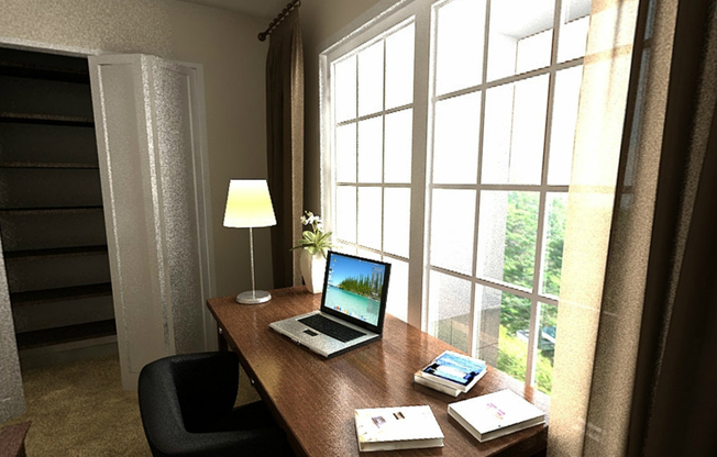 An area of a bedroom fitted with a work desk, wide windows, and carpet flooring at Prairie Point apartments