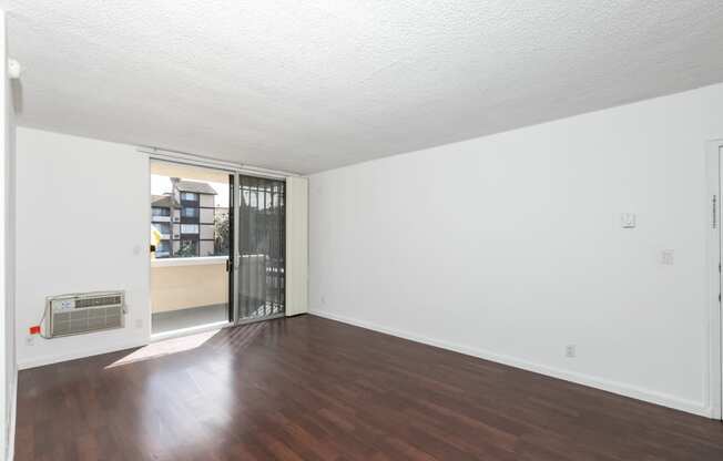 Living Room with Hardwood Floors and Patio Doors