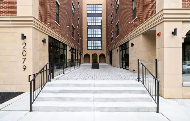 the entrance to a building with stairs in front of it