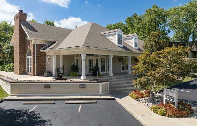 A house with a brick chimney and a porch.
