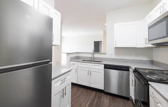 Renovated kitchen featuring appliances at Center Point Apartments, Indianapolis