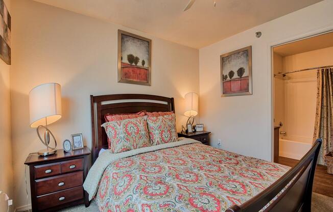 Bedroom with carpet floor, queen size bed, and ceiling fan