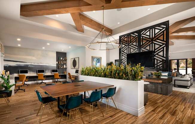 a dining room and living room with a table and chairs