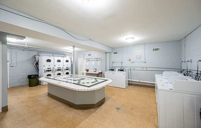 a kitchen with white appliances and a counter top