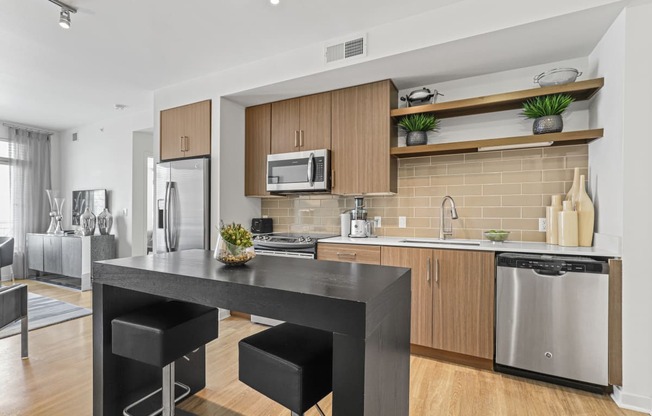 a kitchen and dining area in a 555 waverly unit