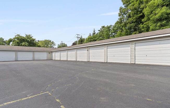 a row of garages in a parking lot
